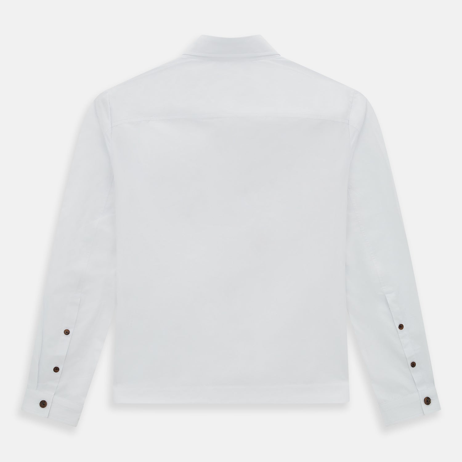 View 3 of product The White Hyde Overshirt by Turnbull & Asser is crafted from sanforised cotton with a left chest pocket and dark buttons—offering a sharp, casual blazer alternative. Shown laid flat on a white background.