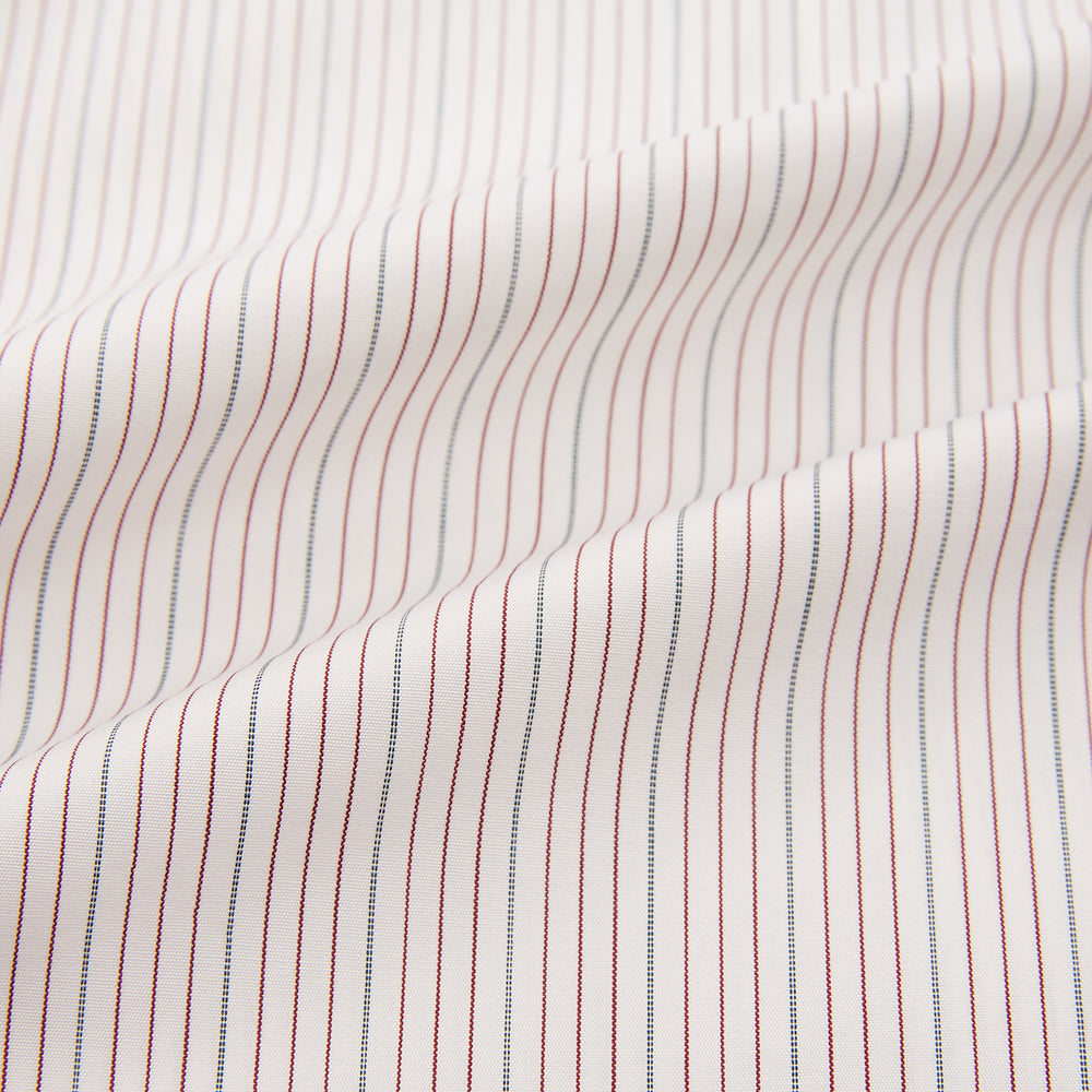 The Turnbull & Asser Burgundy Multi Hairline Stripe Mayfair Shirt features long sleeves, a classic collar, buttoned cuffs, and slim vertical stripes—ideal for formal wear and shown against a plain white background.