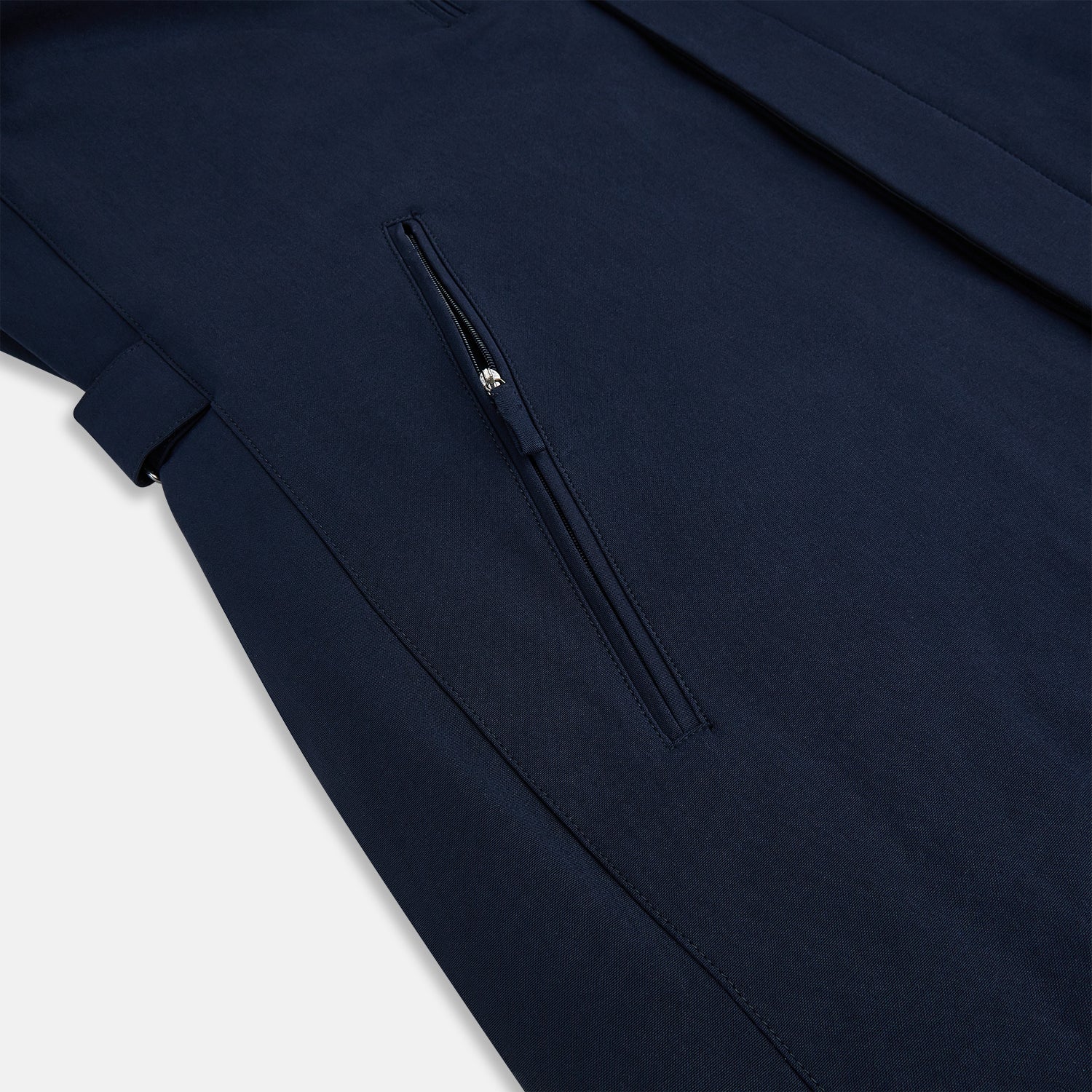 View 6 of product A Navy John Arthur Trench Coat by Turnbull & Asser, featuring a collar, button closure, adjustable cuff straps, two slanted front pockets, and a chest zip pocket, is displayed flat on a white background.