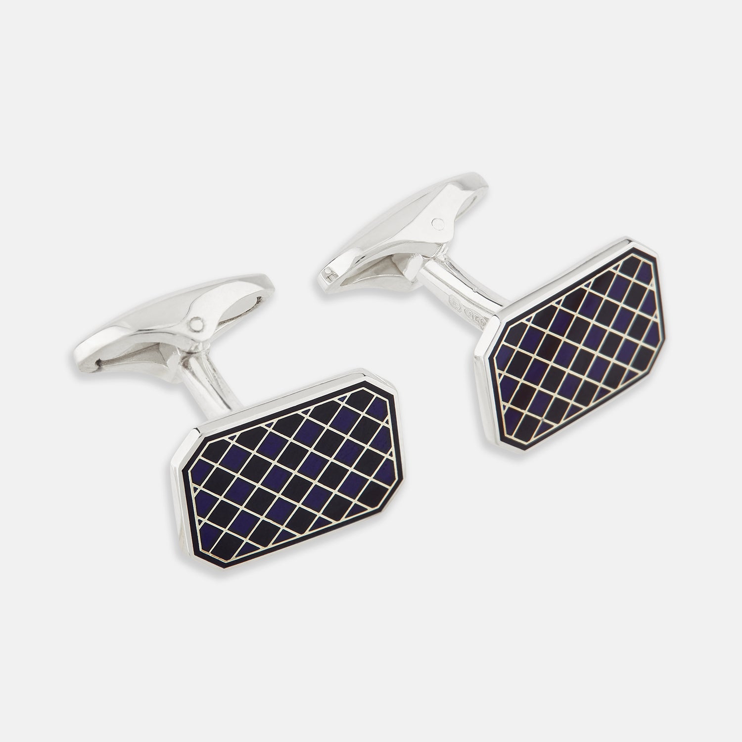 View 1 of product The Turnbull & Asser Navy Checkered Rectangular Enamel Cufflinks feature dark blue enamel faces with a gold grid pattern, blending masculine elegance with timeless style.