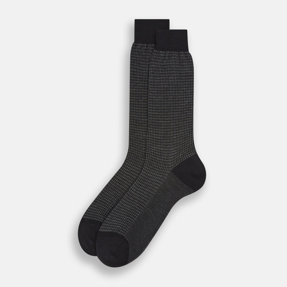 The Turnbull & Asser Charcoal Melange Houndstooth Mid-Length Sock features a black toe, heel, and cuff, and is shown singly against a plain white background.