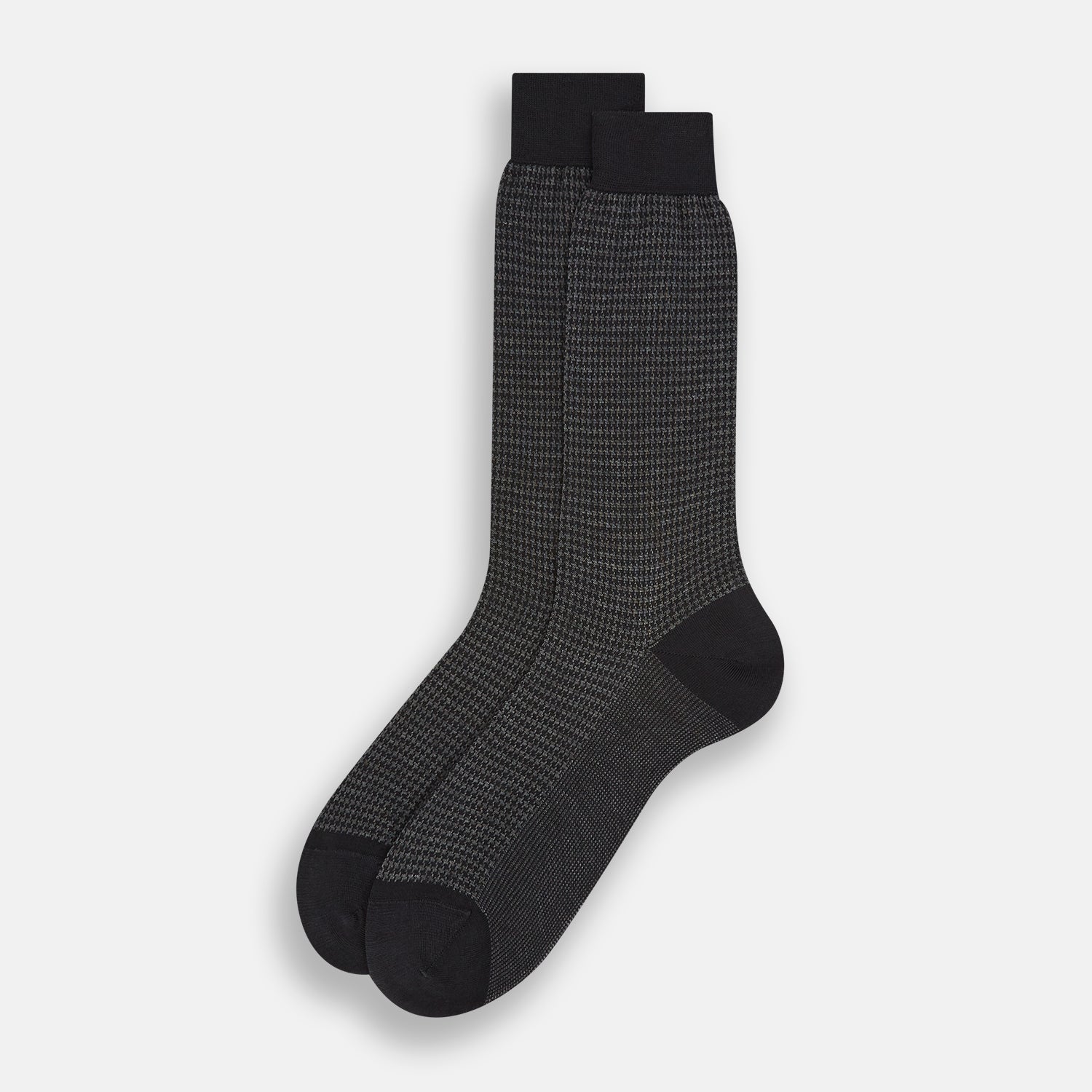 View 2 of product The Turnbull & Asser Charcoal Melange Houndstooth Mid-Length Sock features a black toe, heel, and cuff, and is shown singly against a plain white background.