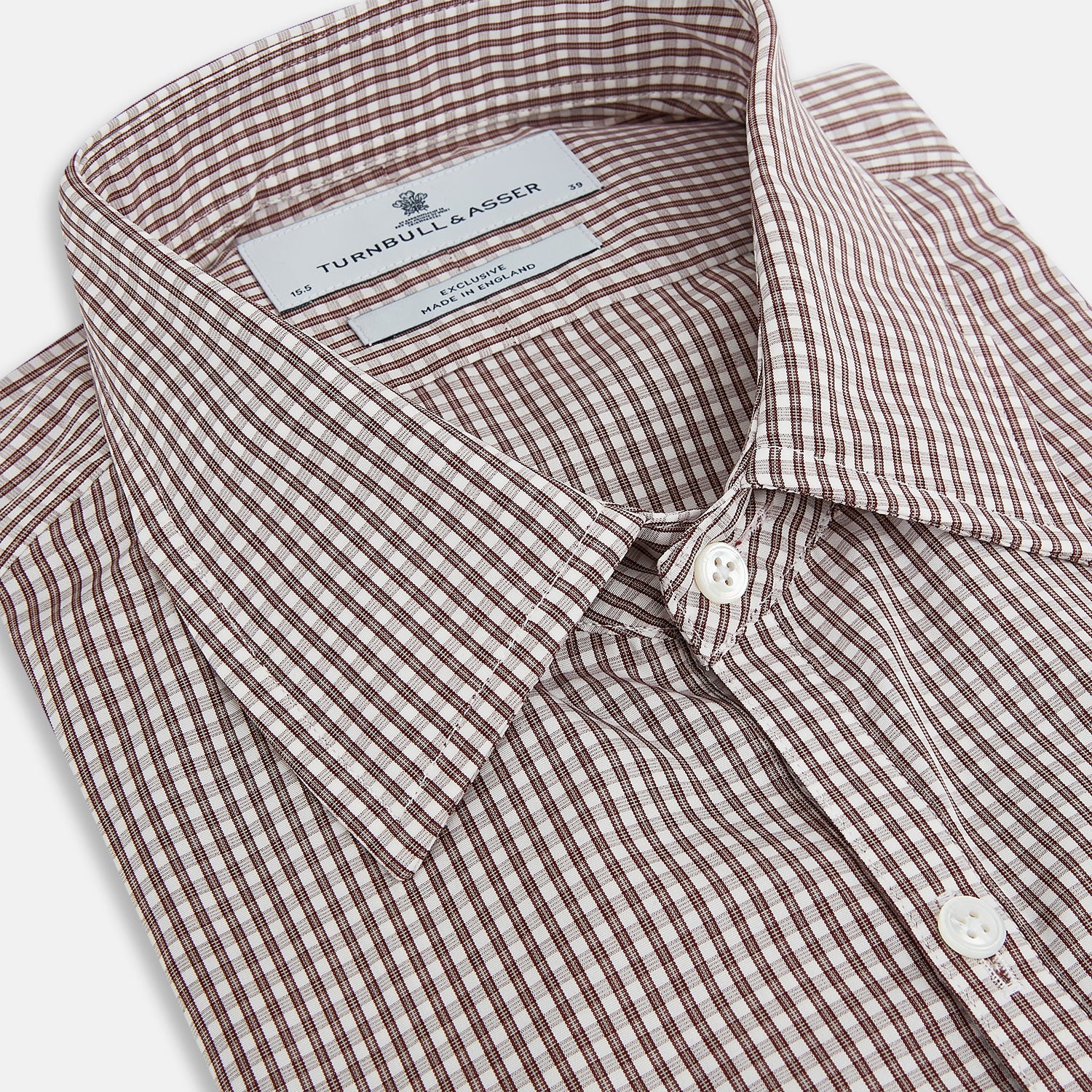 View 2 of product The Turnbull & Asser Burgundy Micro Check Westminster Shirt is a long-sleeved button-up with a classic collar and tailored fit, featuring a subtle micro check pattern, shown against a white background.