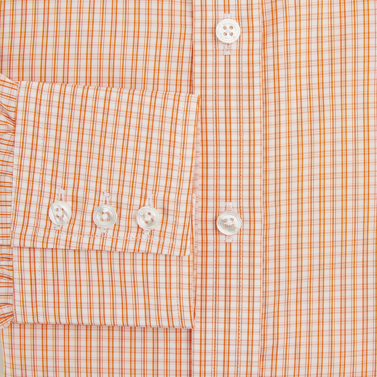 View 4 of product The Turnbull & Asser Orange Micro Check Mayfair Shirt, a long-sleeve button-up with a classic T&A collar and white-orange micro check pattern, is shown neatly laid flat on a white background.
