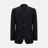 View 1 of product The Turnbull & Asser Long Navy Single Breasted Classic Blazer features British tailoring with two gold buttons, notched lapels, and three front pockets, shown on a plain white background.