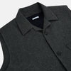 View 2 of product The Graphite Melange Collared Single-breasted Waistcoat by Turnbull & Asser features a dark gray hue, front buttons, collar, two zippered side pockets, and a chest pocket—perfect for winter. Shown on a plain white background.