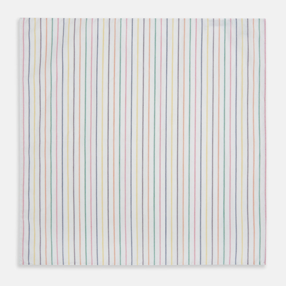 Turnbull & Asser’s Rainbow Double Pinstripe Hand-Rolled Handkerchief features a white square design with slim red, blue, green, and yellow stripes and refined hand-rolled edges.