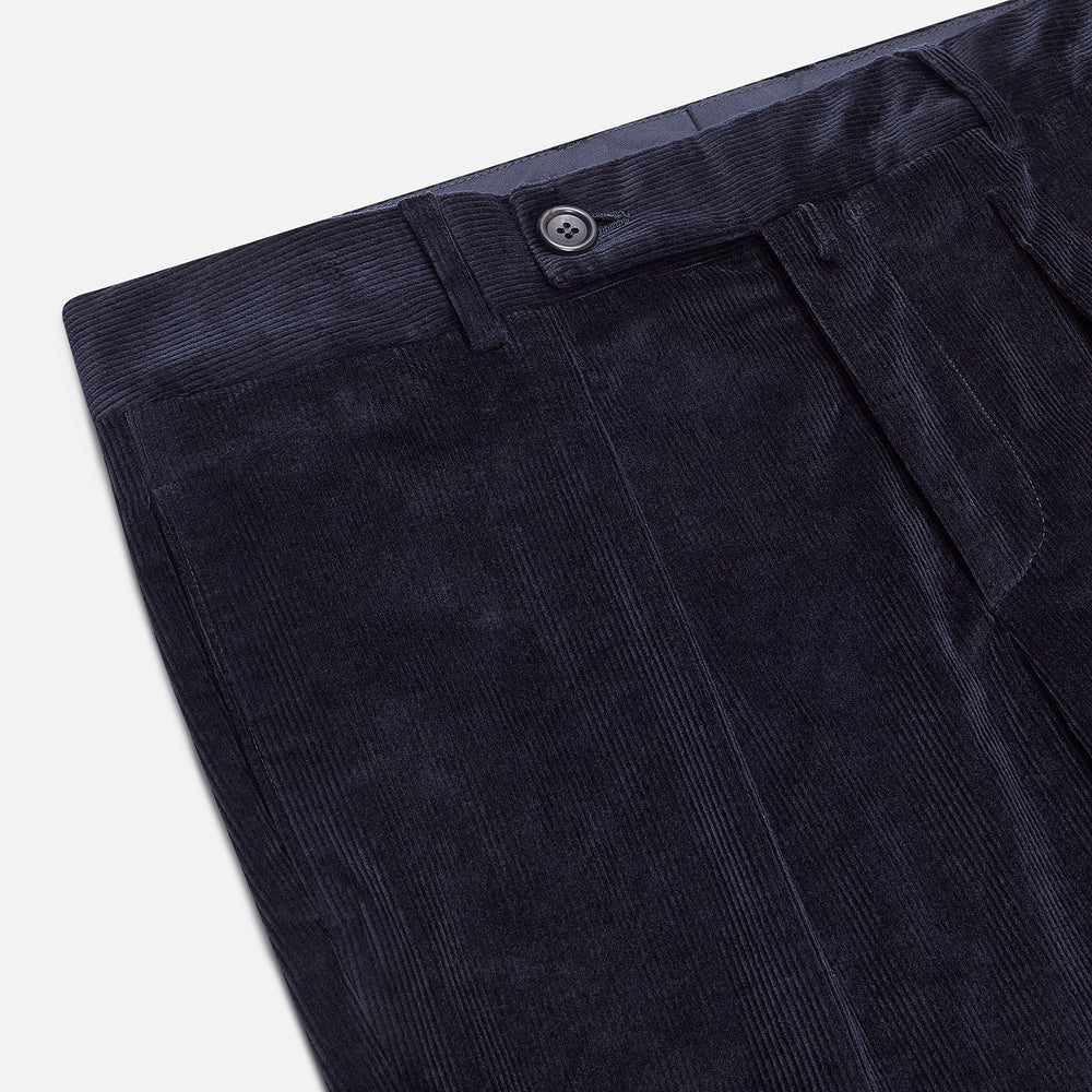 Turnbull & Asser’s Navy Corduroy Edward Trousers feature a straight-leg cut, button closure, and side pockets, shown on a plain white background.