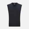 View 1 of product The Turnbull & Asser Dark Green Melange Cashmere V-Neck Vest features a sleeveless design and ribbed hem, offering a refined look, showcased on a plain white background.