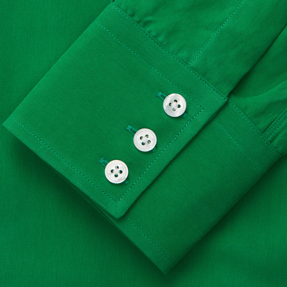 The Green Sandwashed Silk Regular Fit Mayfair Shirt by Turnbull & Asser, featuring long sleeves, a T&A collar, and white buttons, is displayed flat on a white background.
