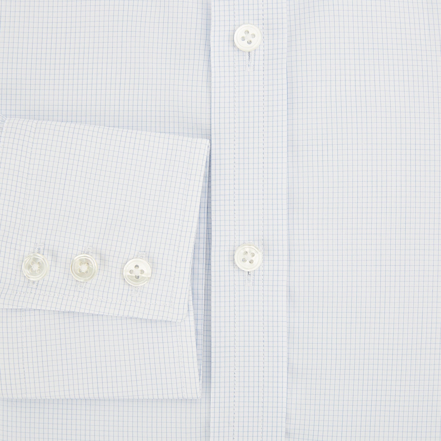 View 5 of product The Turnbull & Asser Blue and White Micro Check Mayfair Shirt features a pointed collar and white buttons, shown flat against a white background.