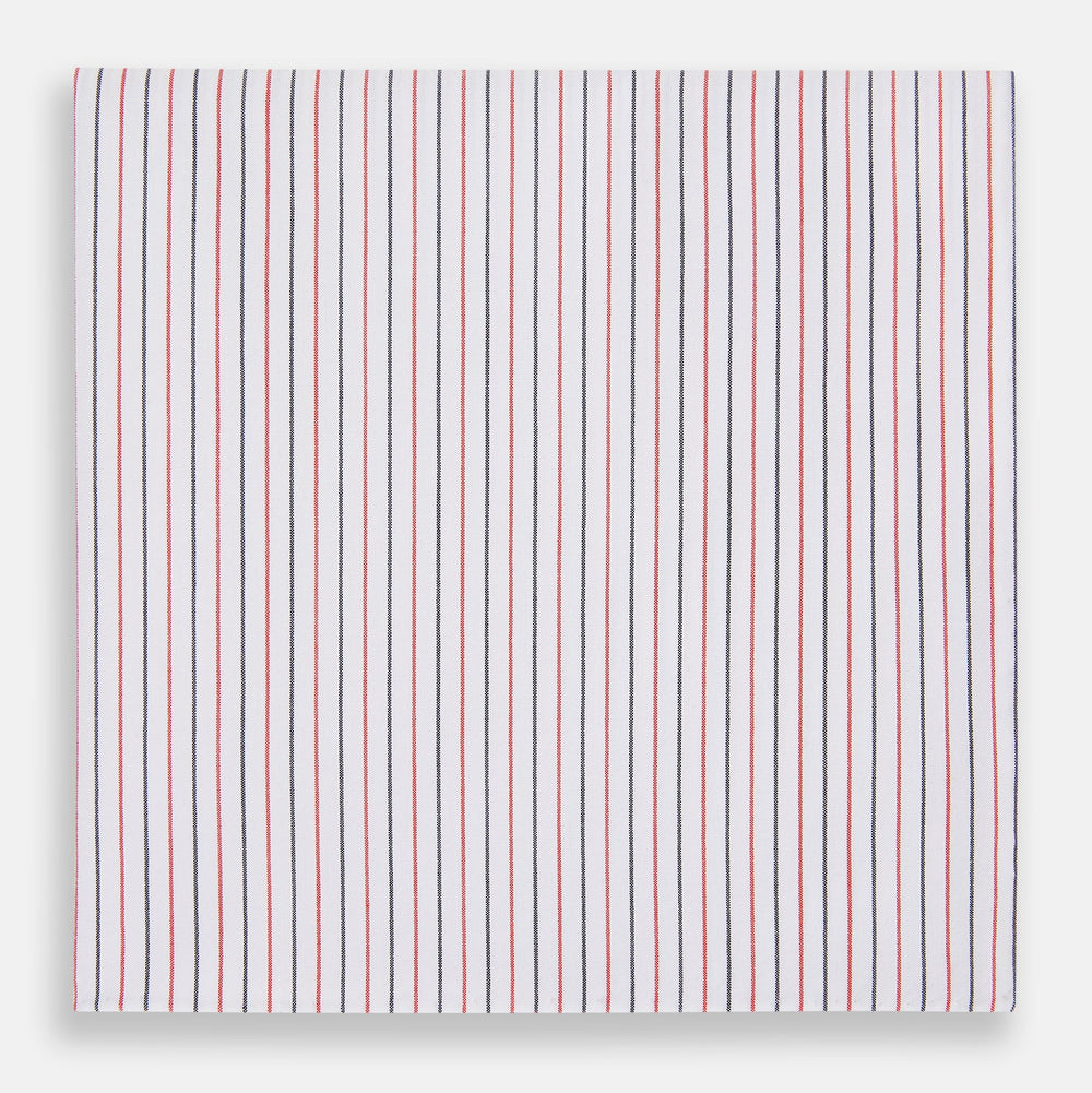 The Turnbull & Asser Hand Rolled Red and Navy Pinstripe Handkerchief features evenly spaced vertical stripes on white cotton, offering a clean, classic look as an elegant gentleman's accessory or stylish pocket square.