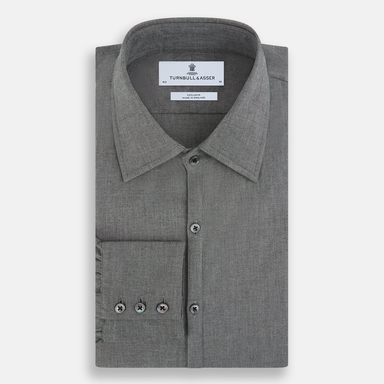 View 5 of product The Pale Charcoal Westminster Shirt by Turnbull & Asser features British craftsmanship with a tailored silhouette, long sleeves, pointed collar, buttoned cuffs, and a solid pale charcoal hue, elegantly shown against a white background.