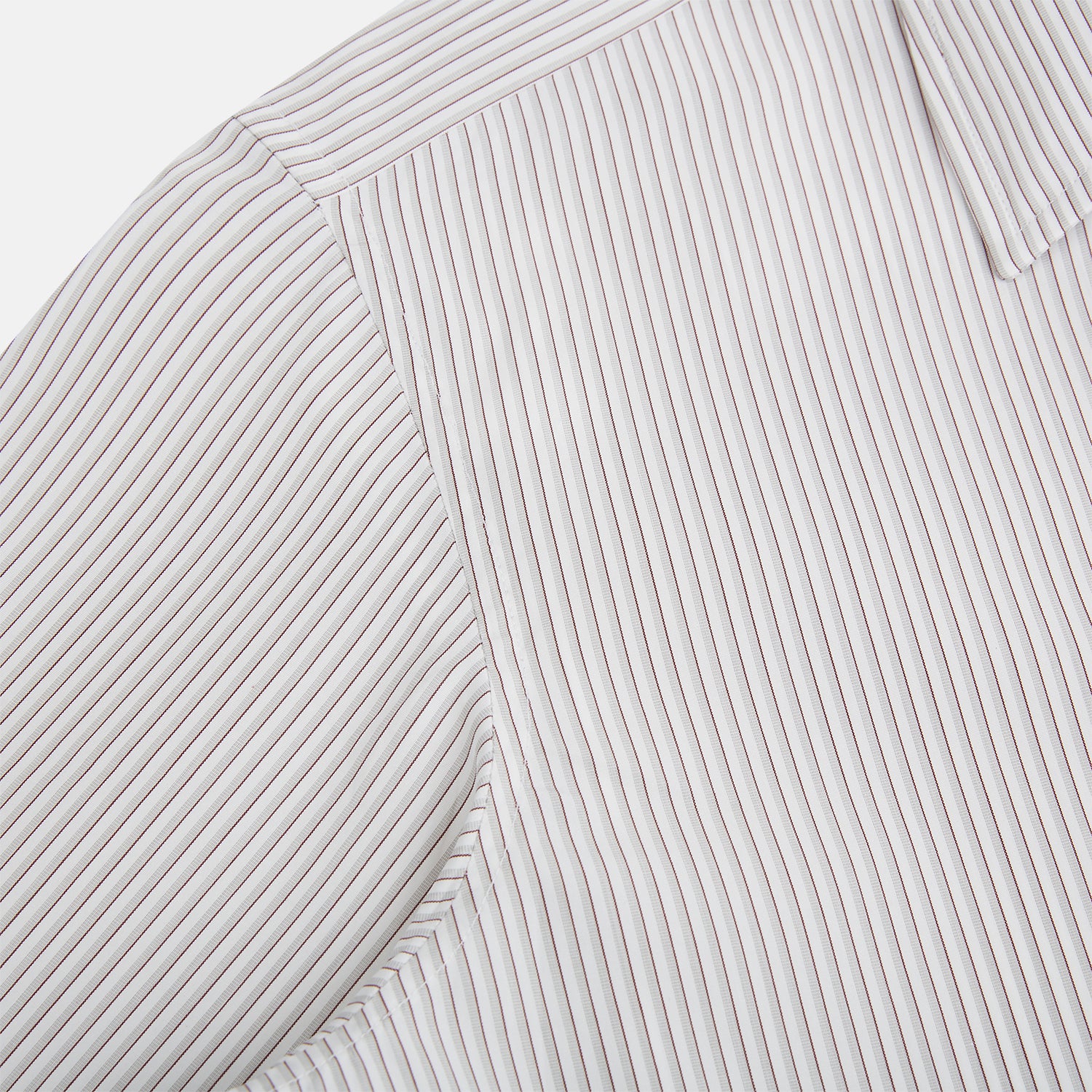 View 6 of product The Coffee and Grey Shadow Pinstripe Westminster Shirt by Turnbull & Asser features thin white and gray stripes, a long sleeve, button-down style, and signature collar, all reflecting classic British craftsmanship.