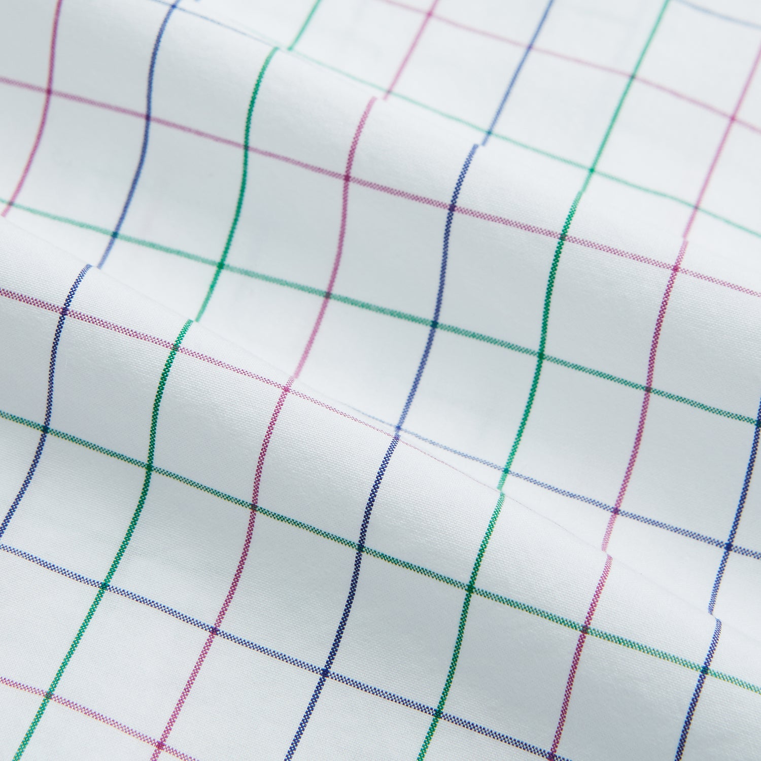 View 6 of product The Turnbull & Asser Pink Grid Check Mayfair Shirt is a long-sleeve, button-down shirt with a T&A collar, crafted from organic cotton and featuring a pink checkered grid pattern on white with buttoned cuffs.