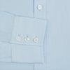 View 3 of product The Turnbull & Asser Light Blue Sea Island Quality Cotton Shirt features a T&A collar, long sleeves, and 3-button cuffs, beautifully displayed flat on a white background.