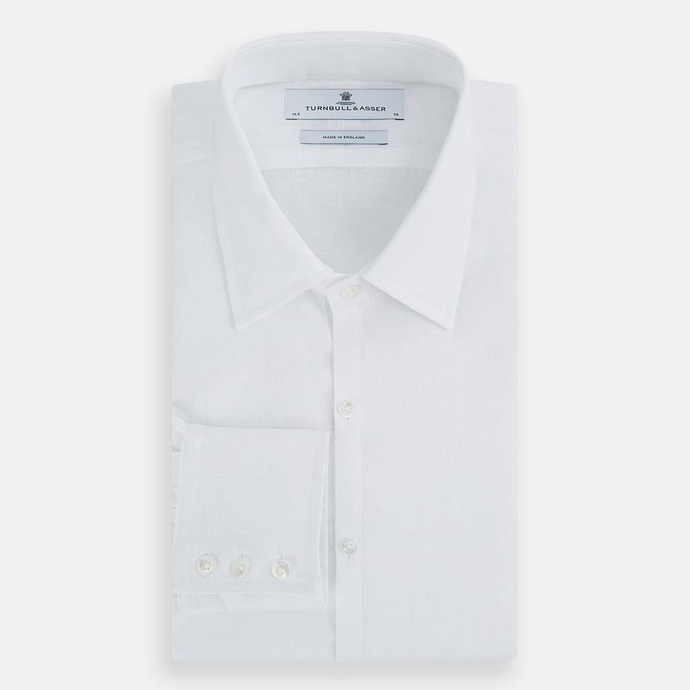 The White Linen Westminster Shirt by Turnbull & Asser features a classic Turnbull collar and button-down front, highlighting British craftsmanship against a plain white background.