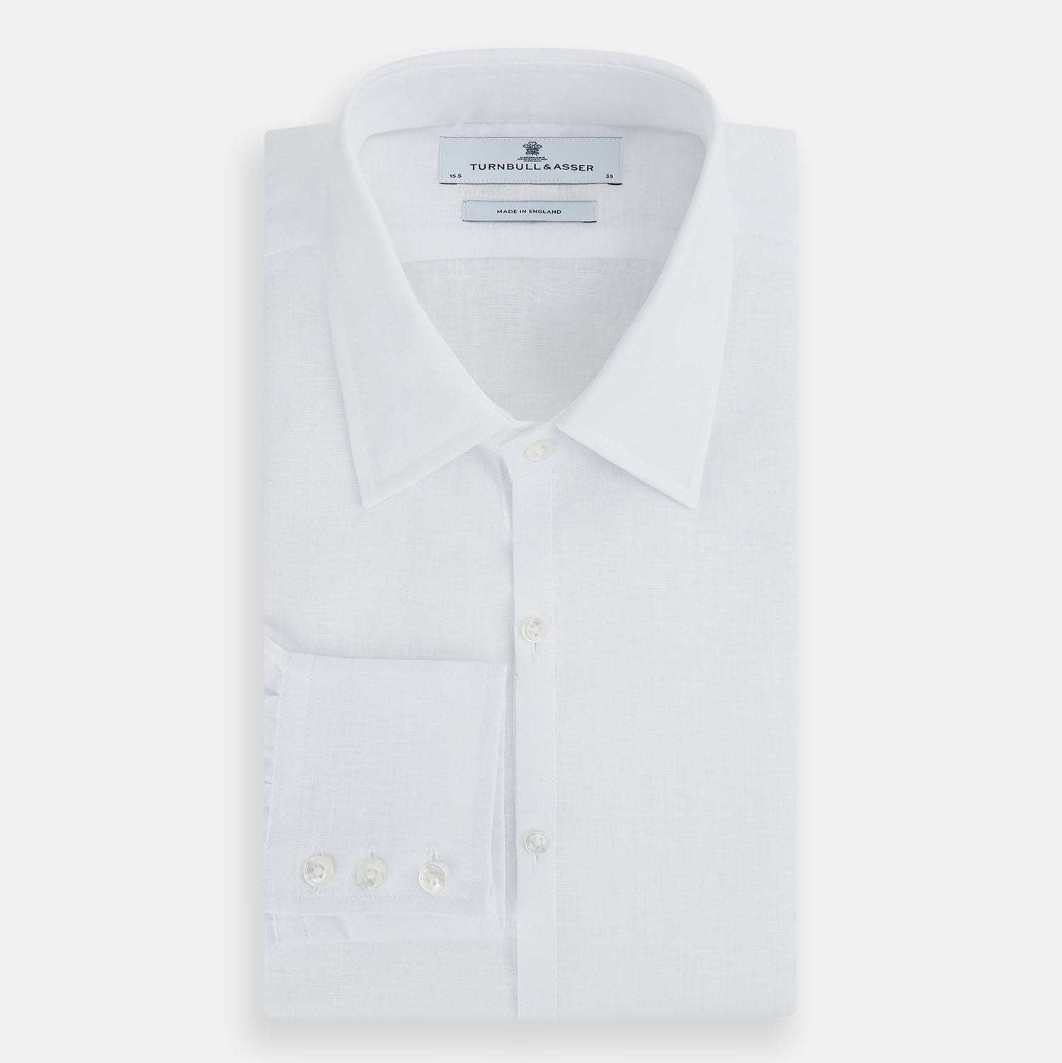 View 5 of product The White Linen Westminster Shirt by Turnbull & Asser features a classic Turnbull collar and button-down front, highlighting British craftsmanship against a plain white background.