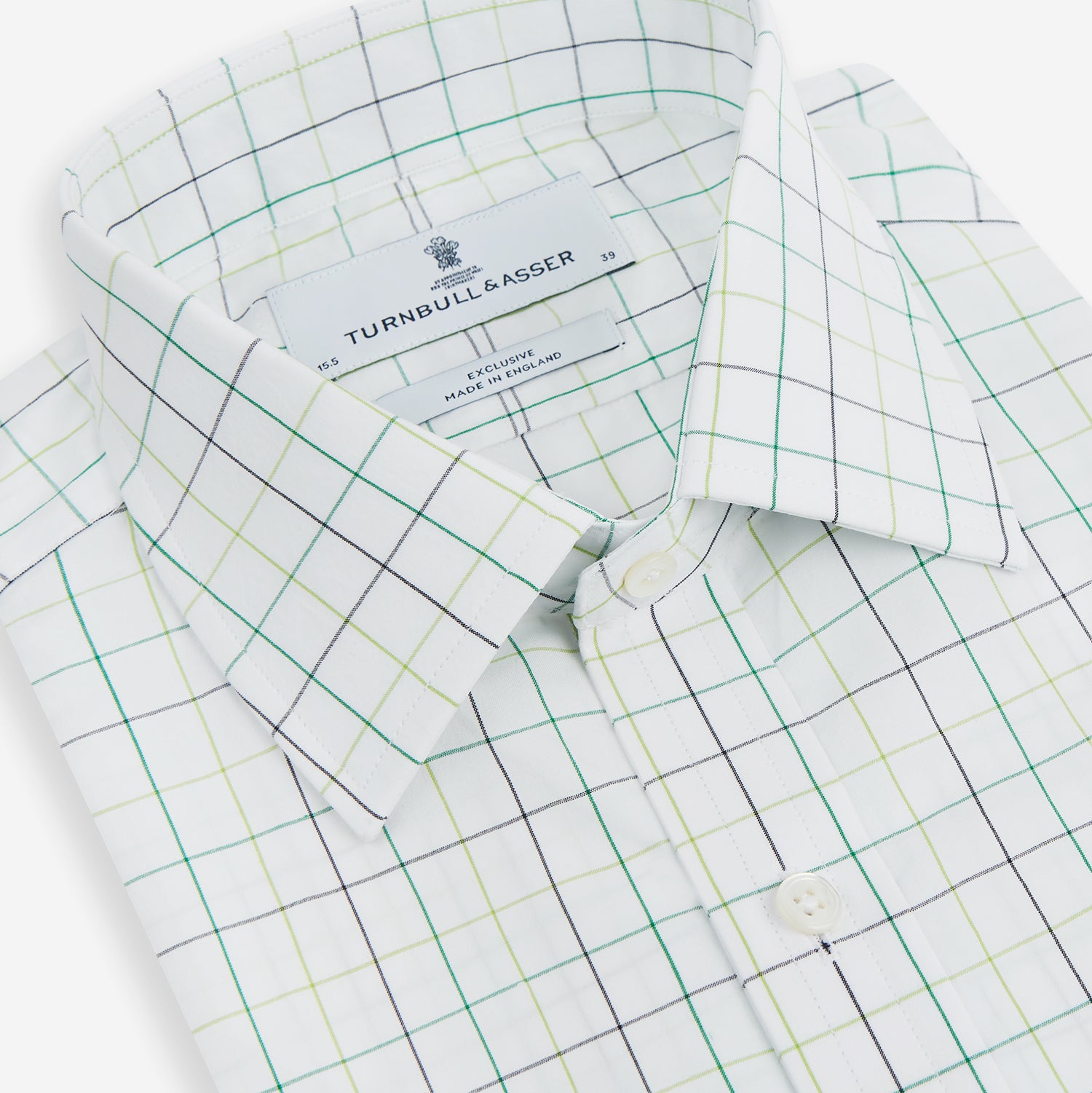View 2 of product The Turnbull & Asser Dark Green Grid Check Mayfair Shirt features a white base with blue and dark green checks, a classic T&A collar, buttoned cuffs, and a Mayfair fit. The long-sleeve shirt is shown laid flat on a white background.