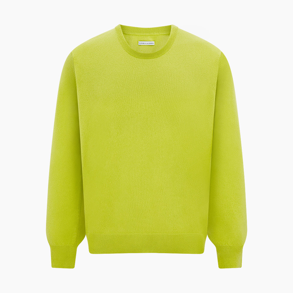 The Turnbull & Asser Lemon Green Cashmere Round Neck Jumper features long sleeves with ribbed cuffs and hem, displayed on a white background.