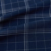 View 8 of product The Indigo and White Thin Plaid Check Windsor Shirt by Turnbull & Asser, a long-sleeve button-up with white buttons, is shown laid flat on a white background.