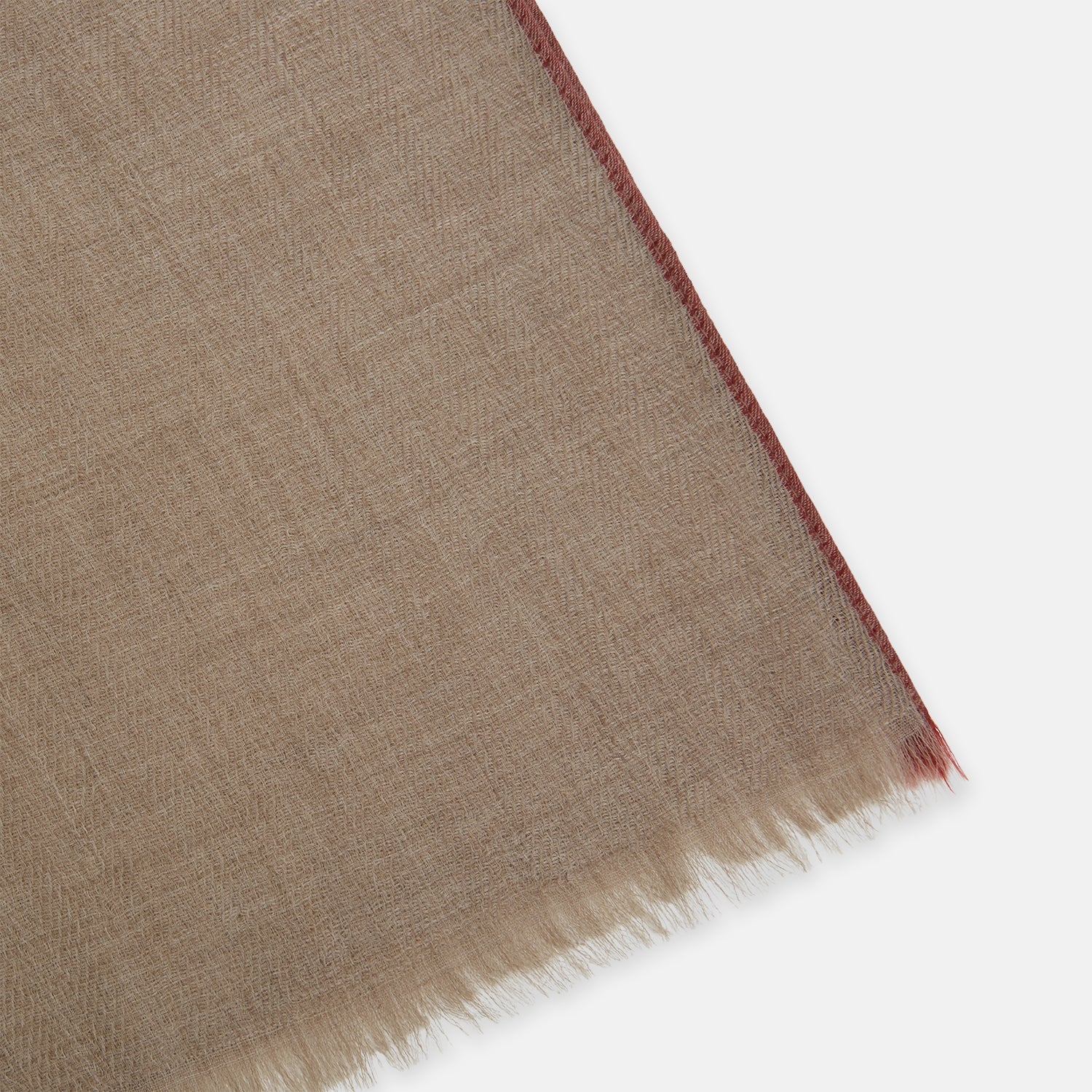 View 2 of product The Turnbull & Asser Camel and Cognac Cashmere Scarf features a subtle texture and softly frayed edges, elegantly knotted at the center—an ideal formal accessory. Displayed against a white background.