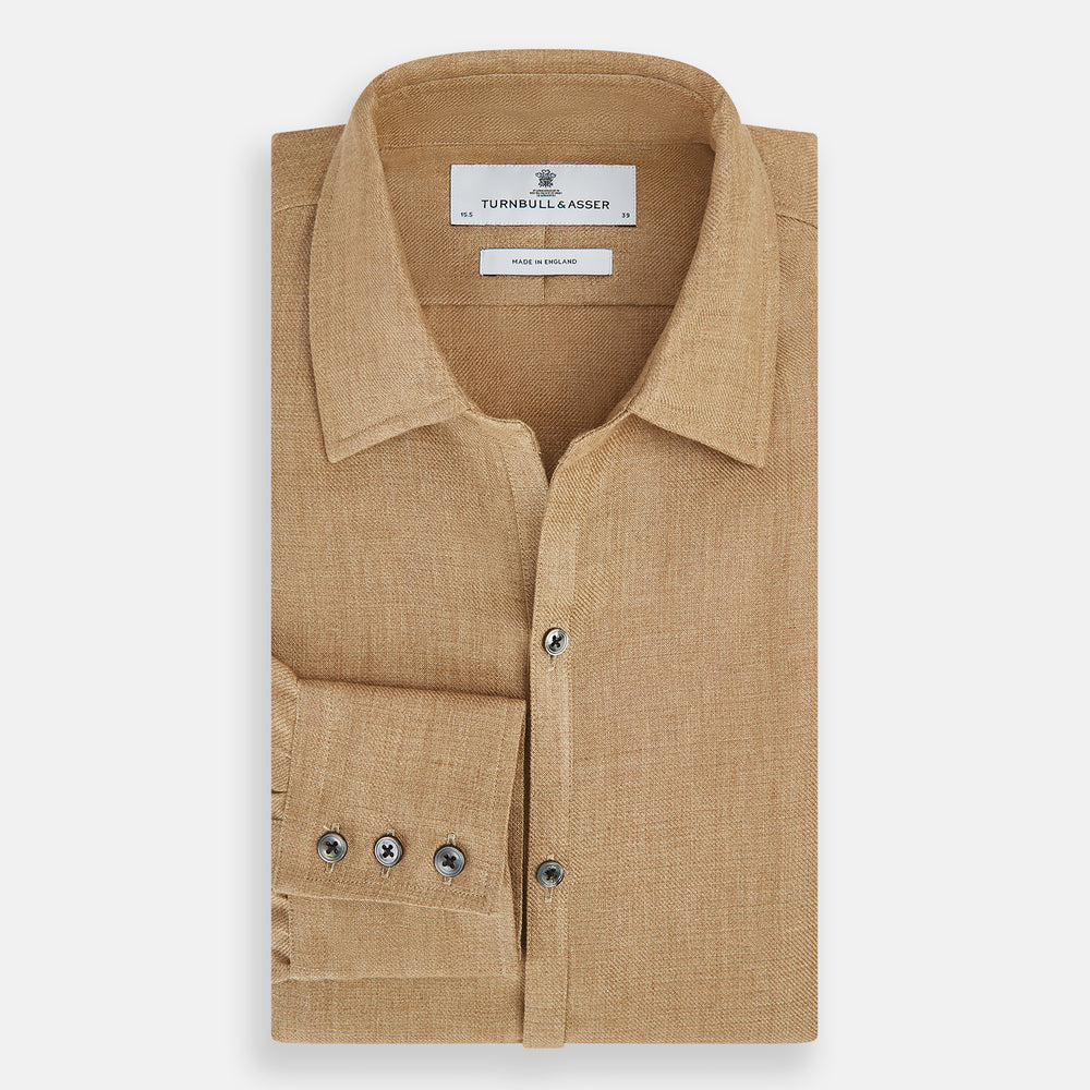 The Turnbull & Asser Camel Linen Windsor Shirt features long sleeves, a tailored fit, and classic collar in light brown camel linen, shown against a white background.
