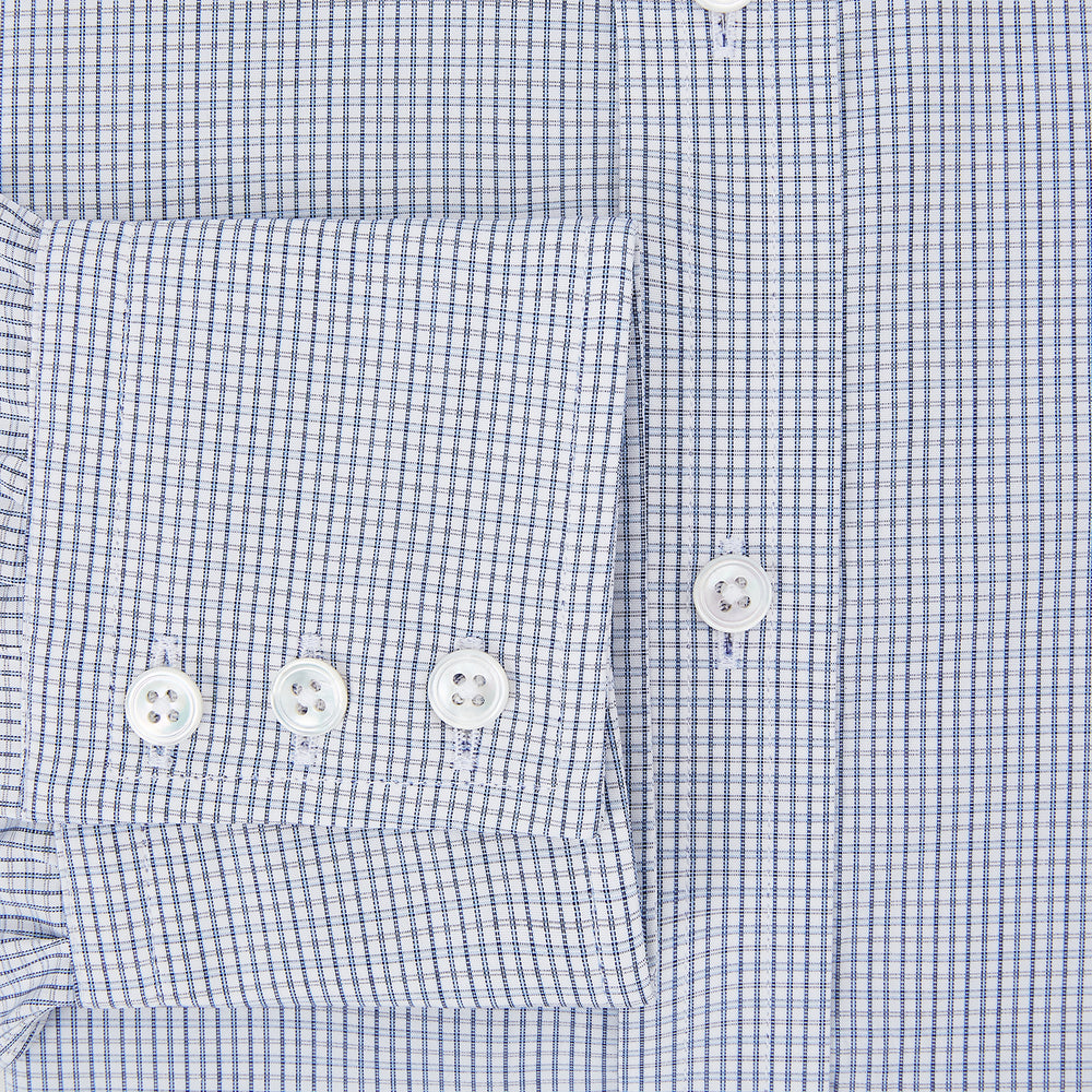 The Turnbull & Asser Blue Micro Graph Check Mayfair Shirt features long sleeves, a subtle check pattern, T&A collar, and buttoned cuffs, shown laid flat on a white background.