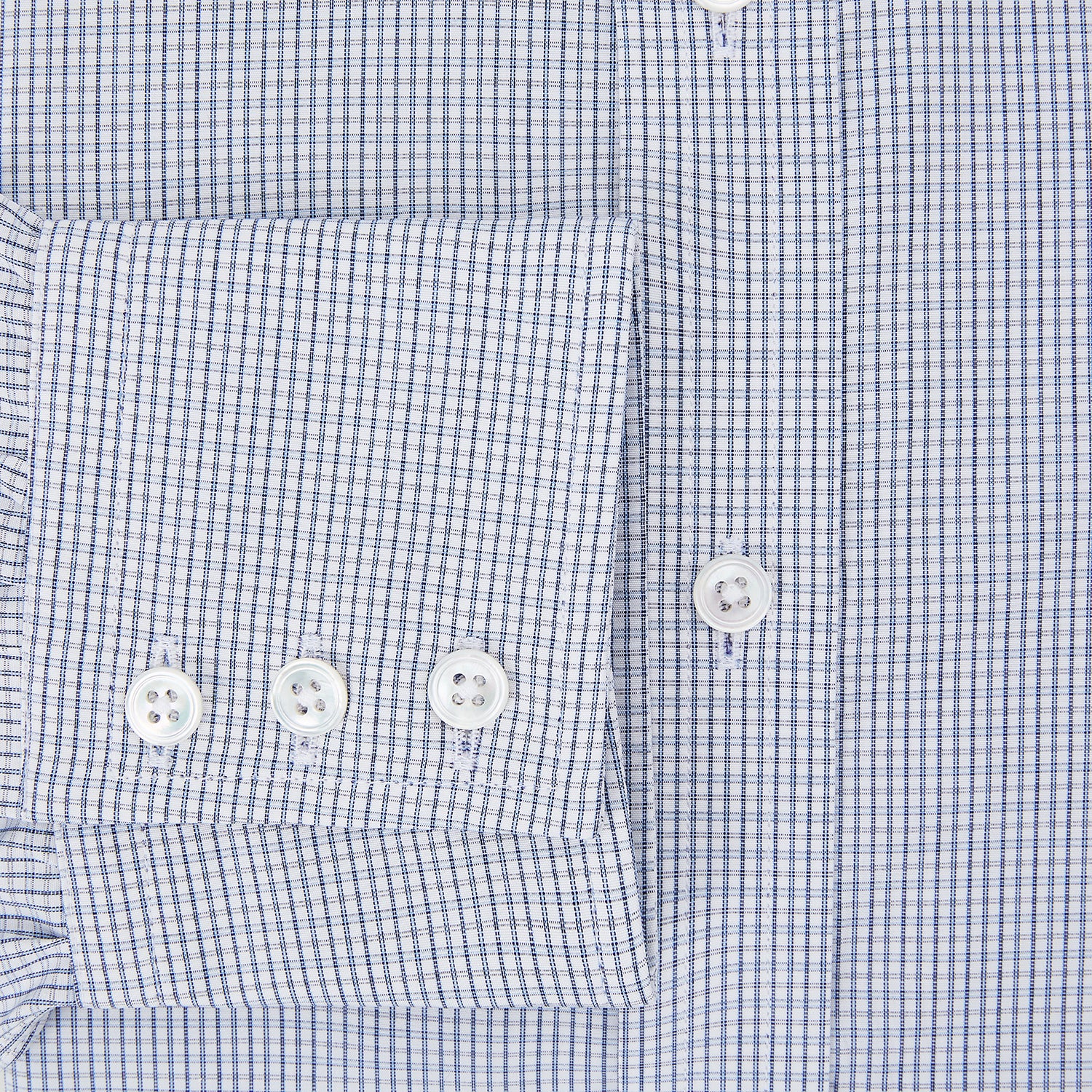 View 4 of product The Turnbull & Asser Blue Micro Graph Check Mayfair Shirt features long sleeves, a subtle check pattern, T&A collar, and buttoned cuffs, shown laid flat on a white background.