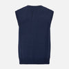 View 3 of product The NAVY MERINO V-NECK SLEEVELESS CARDIGAN by Turnbull & Asser features a button-down front, ribbed edges, and two front pockets—an elegant layering piece for stylish menswear.