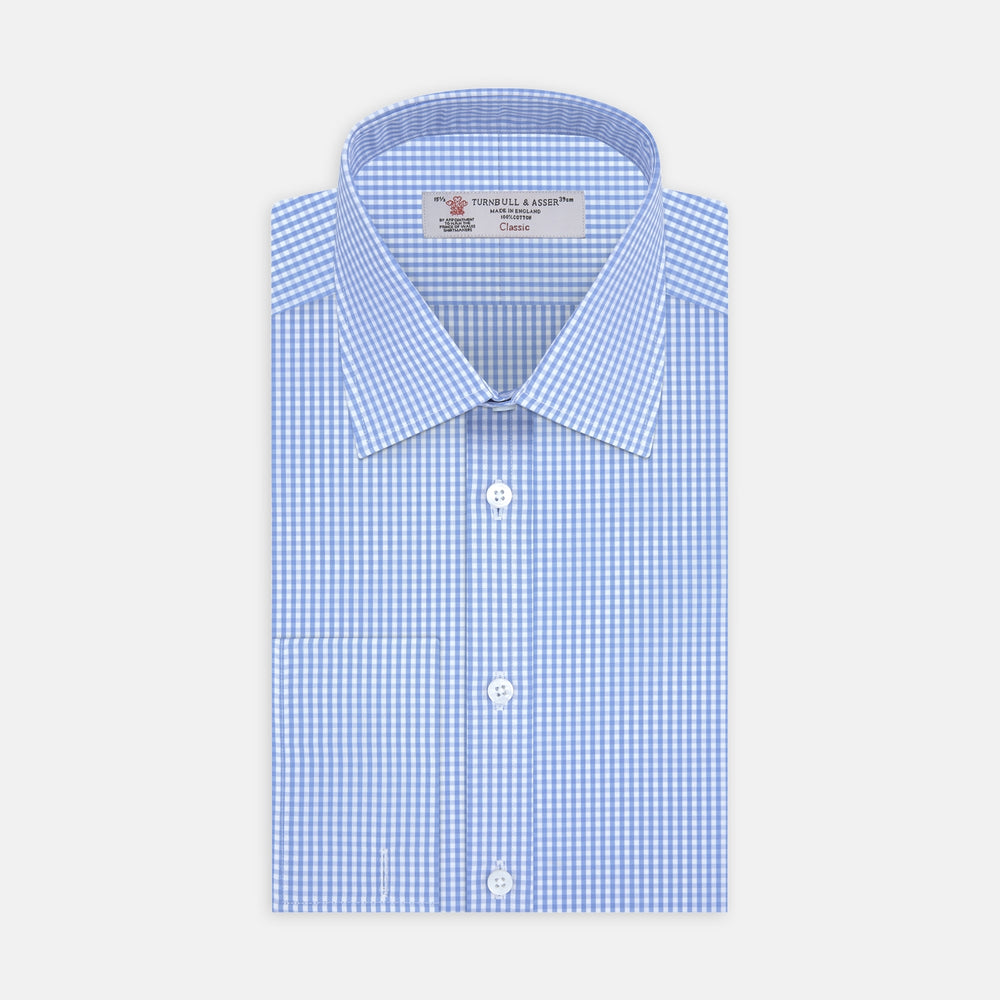 The Turnbull & Asser Blue and White Check Shirt features a T & A collar, double cuff, small check pattern, and white buttons—crafted from soft cotton for timeless style.