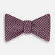 The Indies Red Floral Square-Print Silk Bow Tie by Turnbull & Asser features a geometric blue and white diamond pattern on red silk, styled against a white background for classic British elegance.