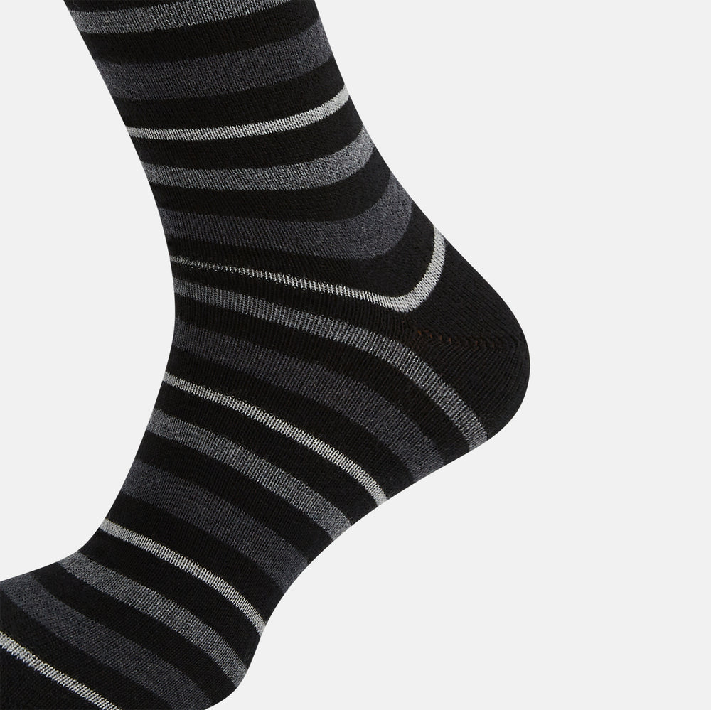 The Turnbull & Asser Chocolate Melange Striped Merino Wool Long Sock features black, dark gray, and light gray horizontal stripes and is displayed individually on a white background.