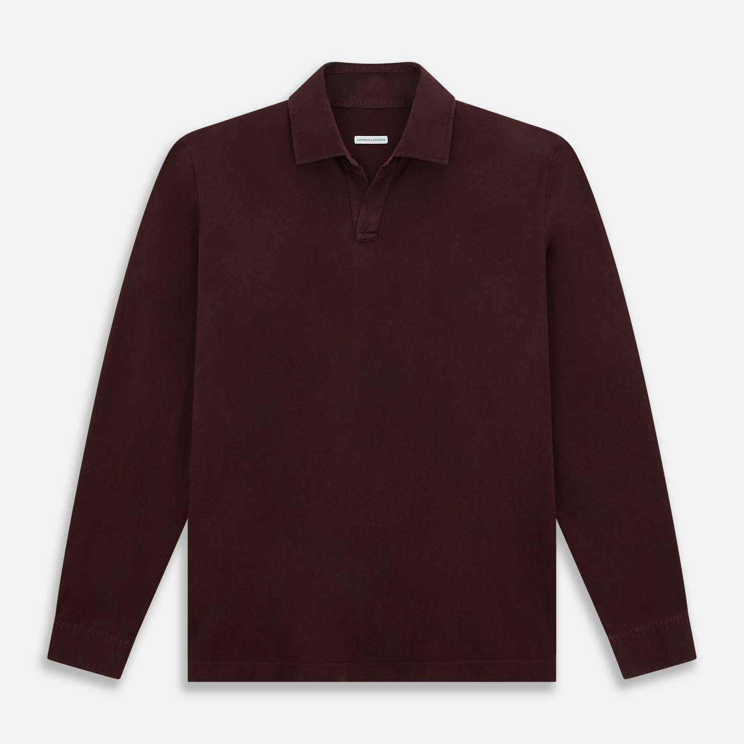 View 1 of product The Turnbull & Asser Burgundy Rugby Polo Shirt is a long-sleeve, pure cotton collared top with no visible buttons, shown laid flat on a white background.