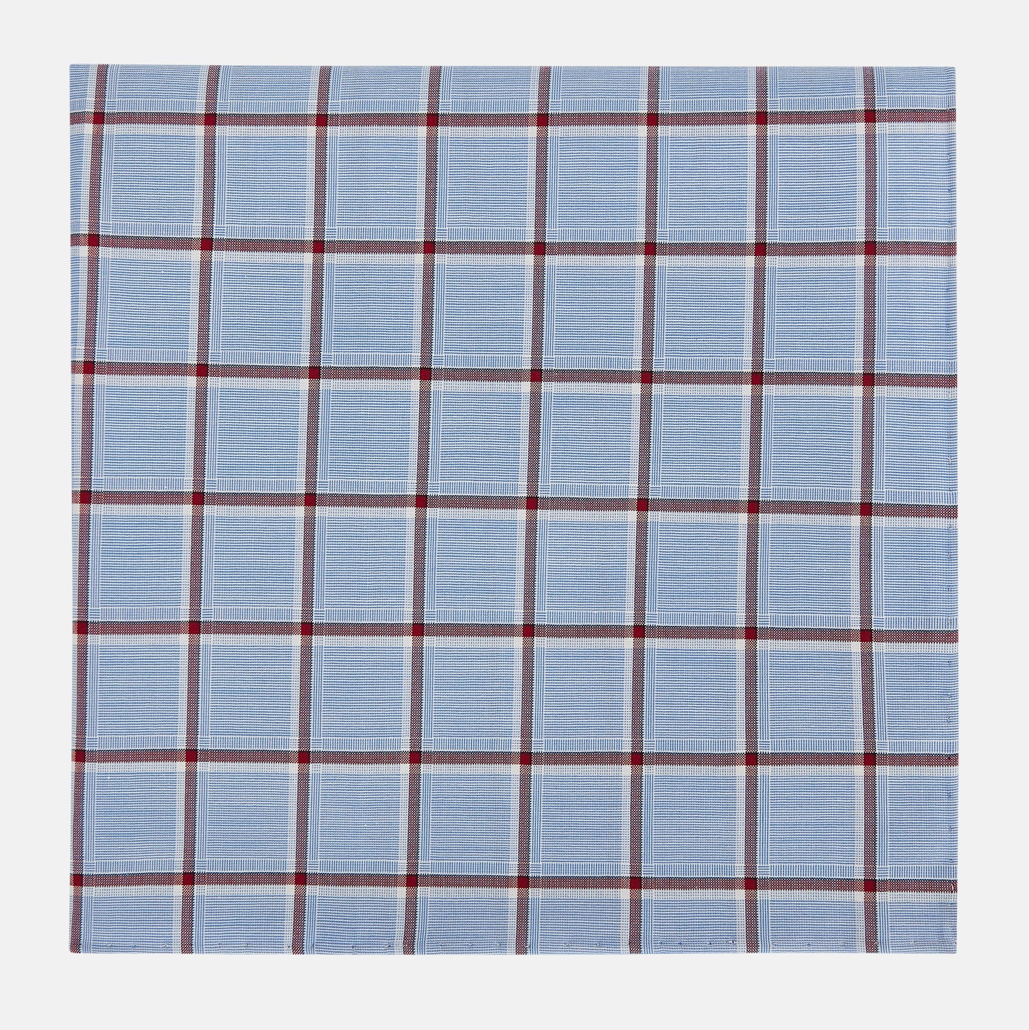 View 1 of product The Turnbull & Asser Blue and Burgundy Windowpane Check Hand-Rolled Handkerchief features a light blue fabric with white, red, and dark blue stripes forming a classic plaid grid.