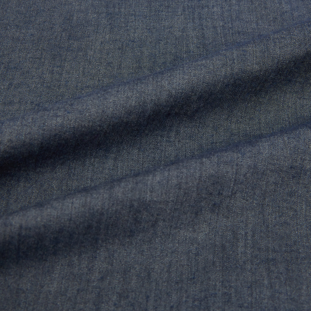 The Turnbull & Asser Azzurro Westminster Shirt in dark grey features long sleeves, a classic collar, buttoned cuffs, and a straight hem, showcased against a white background, highlighting refined British craftsmanship.