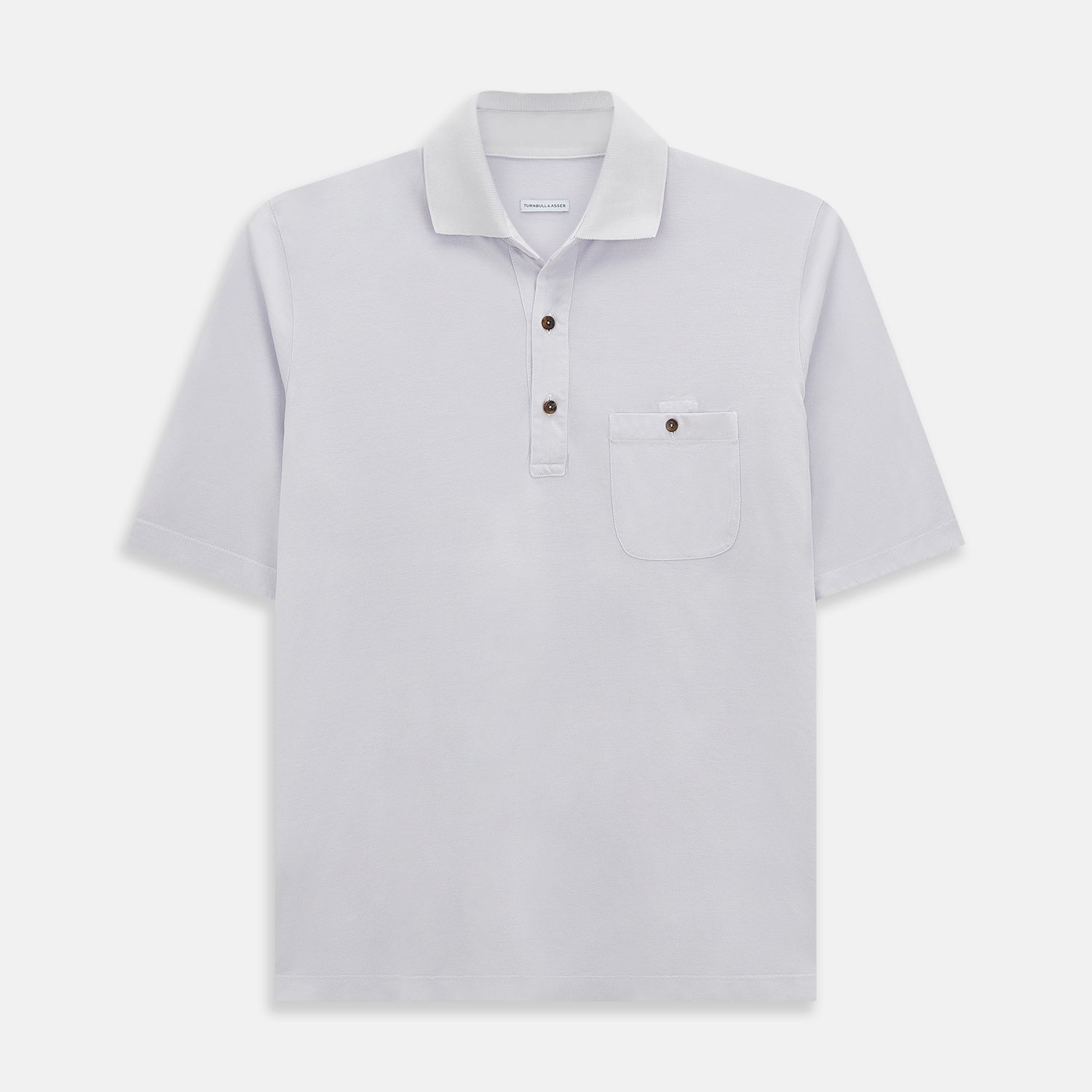 View 1 of product A soft pink cotton polo shirt by Turnbull & Asser features short sleeves, a contrasting white collar, three dark buttons, and a left chest pocket. Laid flat on a white background—it’s perfect for modern men’s fashion.