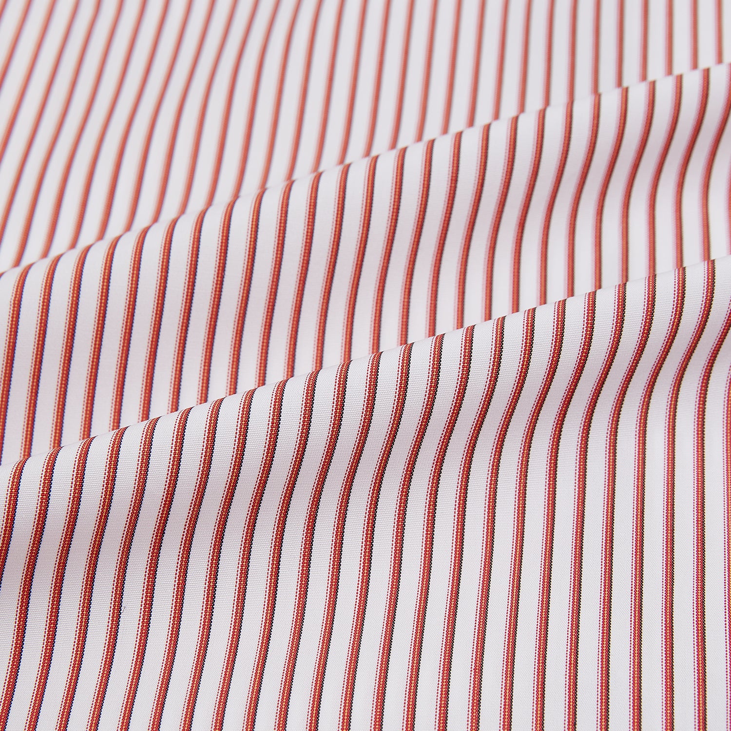 View 8 of product The Red Shadow Stripe Westminster Shirt by Turnbull & Asser features long sleeves, a Turnbull collar, thin red and white vertical stripes, white buttons, and showcases British craftsmanship against a plain white background.