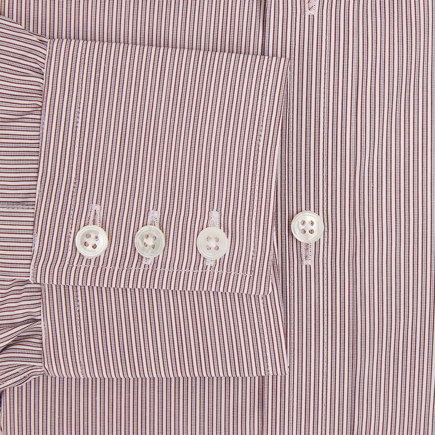 View 4 of product A Red and Pink Ticking Stripe Mayfair Shirt by Turnbull & Asser, featuring a classic T&A collar, buttoned cuffs, and subtle vertical pinstripes, shown on a white background.