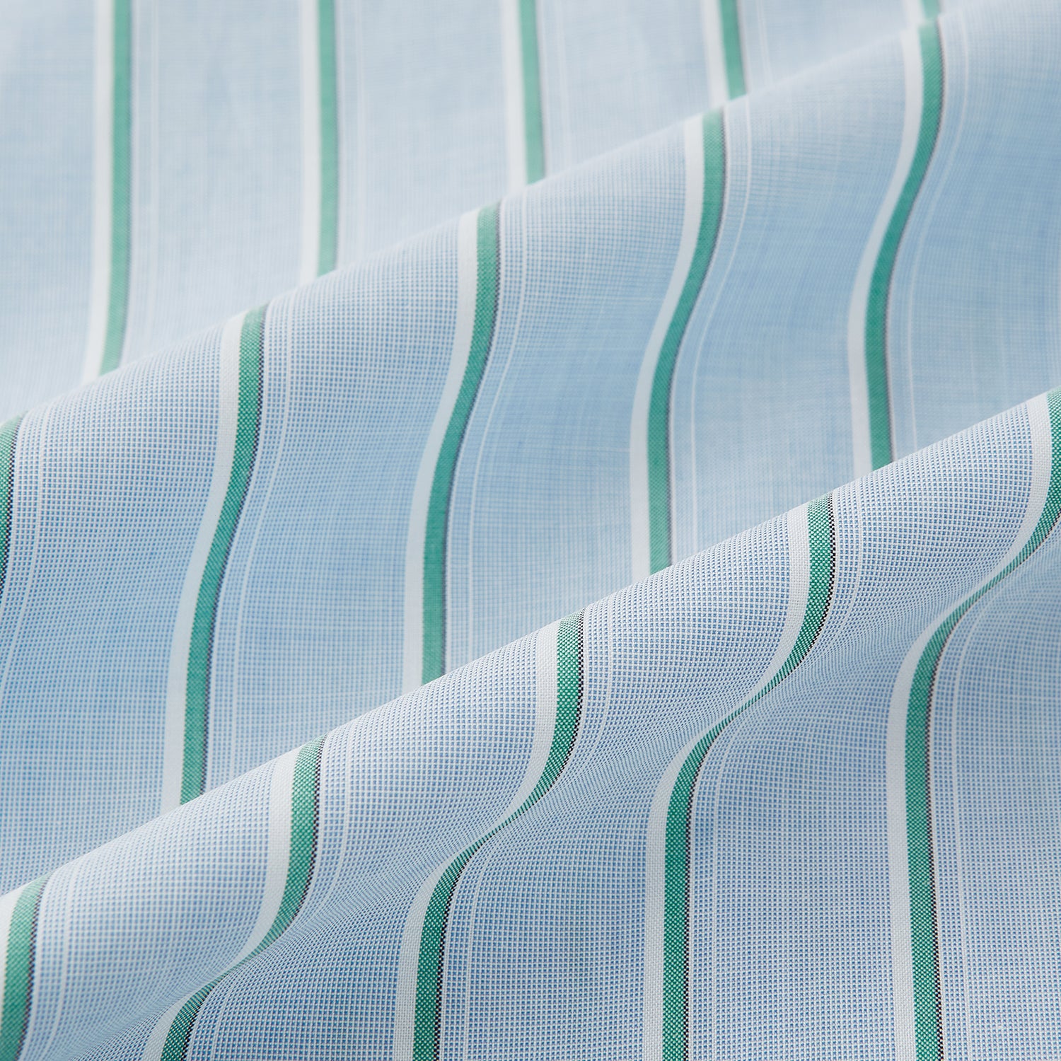 View 8 of product Blue and green multi-stripe Westminster shirt by Turnbull & Asser, featuring a pointed collar and buttoned cuffs—a refined example of British craftsmanship on a plain white background.