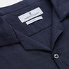 View 2 of product The Turnbull & Asser Navy Hemp Holiday Fit Winnington Shirt is a long-sleeve, button-up shirt with a single chest pocket, shown laid flat on a white background.