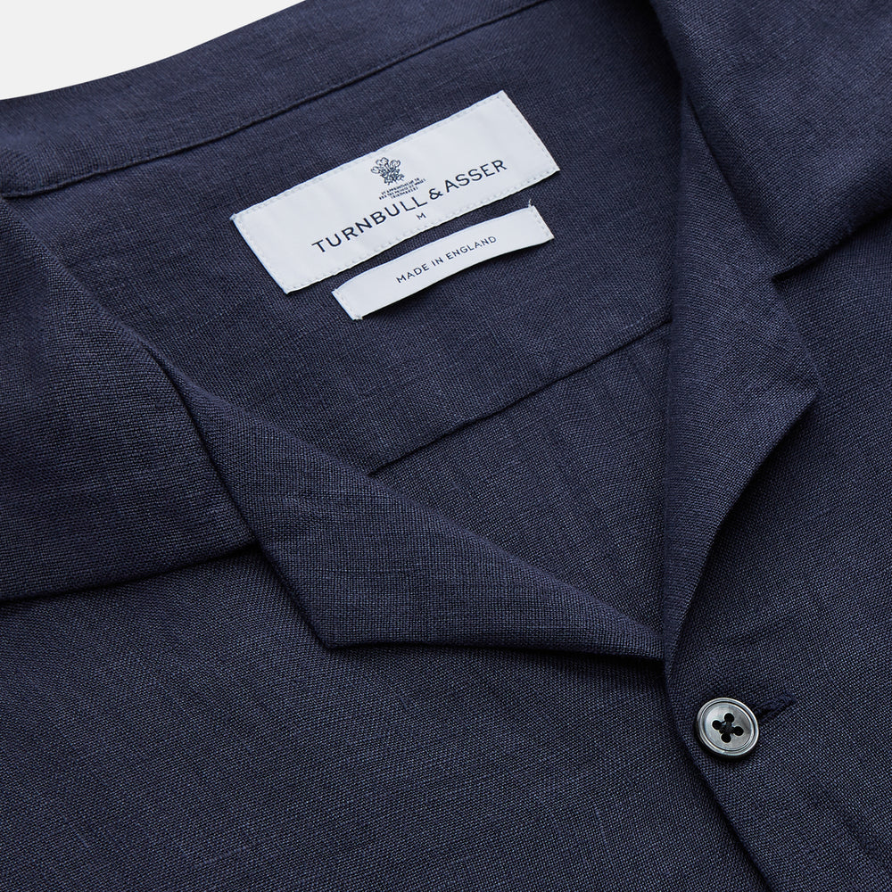The Turnbull & Asser Navy Hemp Holiday Fit Winnington Shirt is a long-sleeve, button-up shirt with a single chest pocket, shown laid flat on a white background.