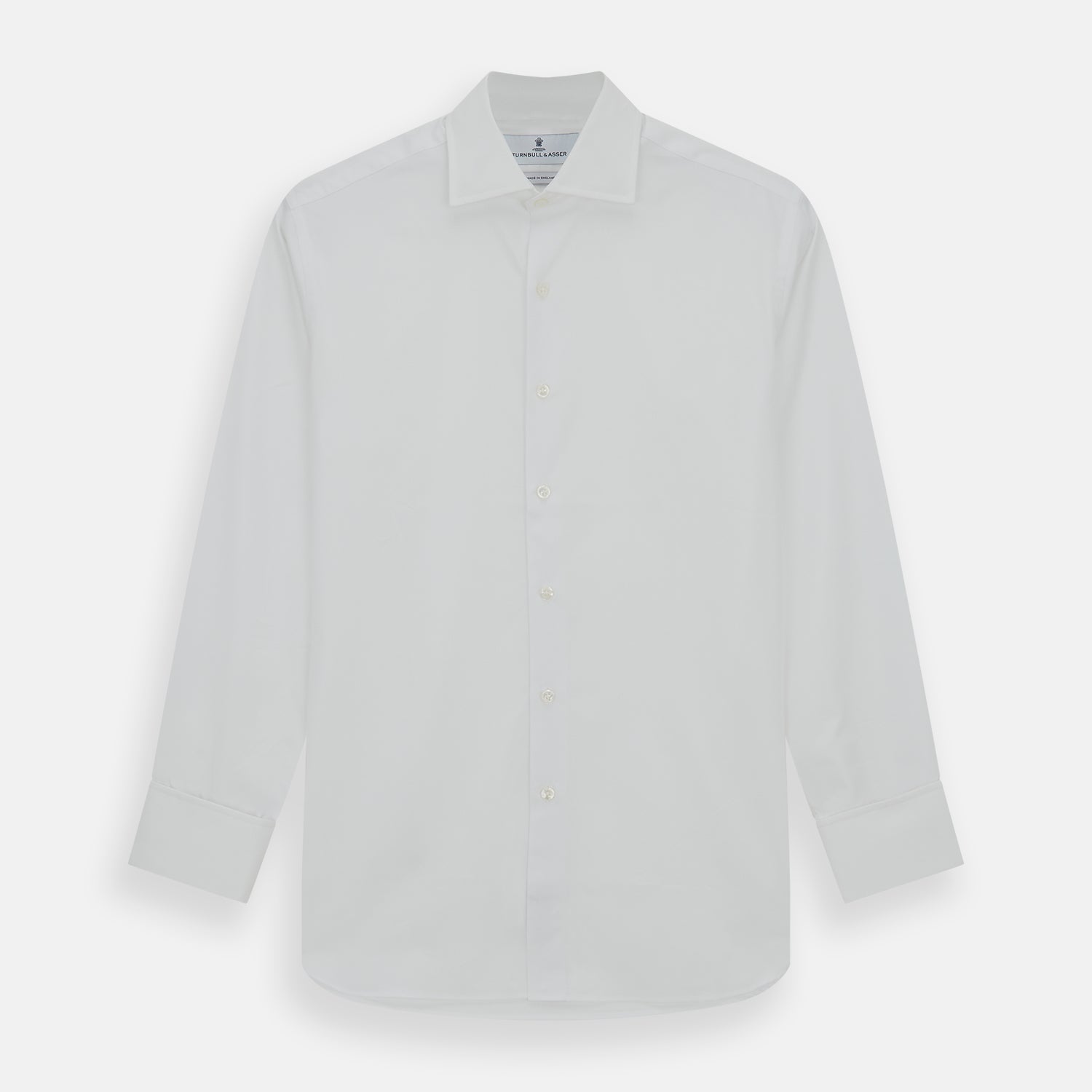 View 1 of product The Turnbull & Asser Tailored Fit Plain White Cotton Shirt features a Kent collar, button-down front, long sleeves, and double cuffs, shown on a white background.