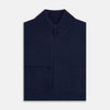 View 4 of product The Turnbull & Asser Navy High Neck Merino Zipped Cardigan is a long-sleeve knit with ribbed mock neck, cuffs, and hem, shown on a plain white background.
