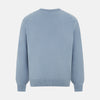 View 3 of product The Turnbull & Asser Frost Blue Cashmere V-Neck Jumper features ribbed cuffs, hem, and neckline. This elegant long sleeve knitwear piece is shown on a plain white background.