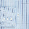 View 4 of product The Navy and Blue Combination Check Mayfair Shirt by Turnbull & Asser features a light blue base with a grid of thin dark blue lines, long sleeves, a pointed collar, and is neatly displayed on a plain white background.