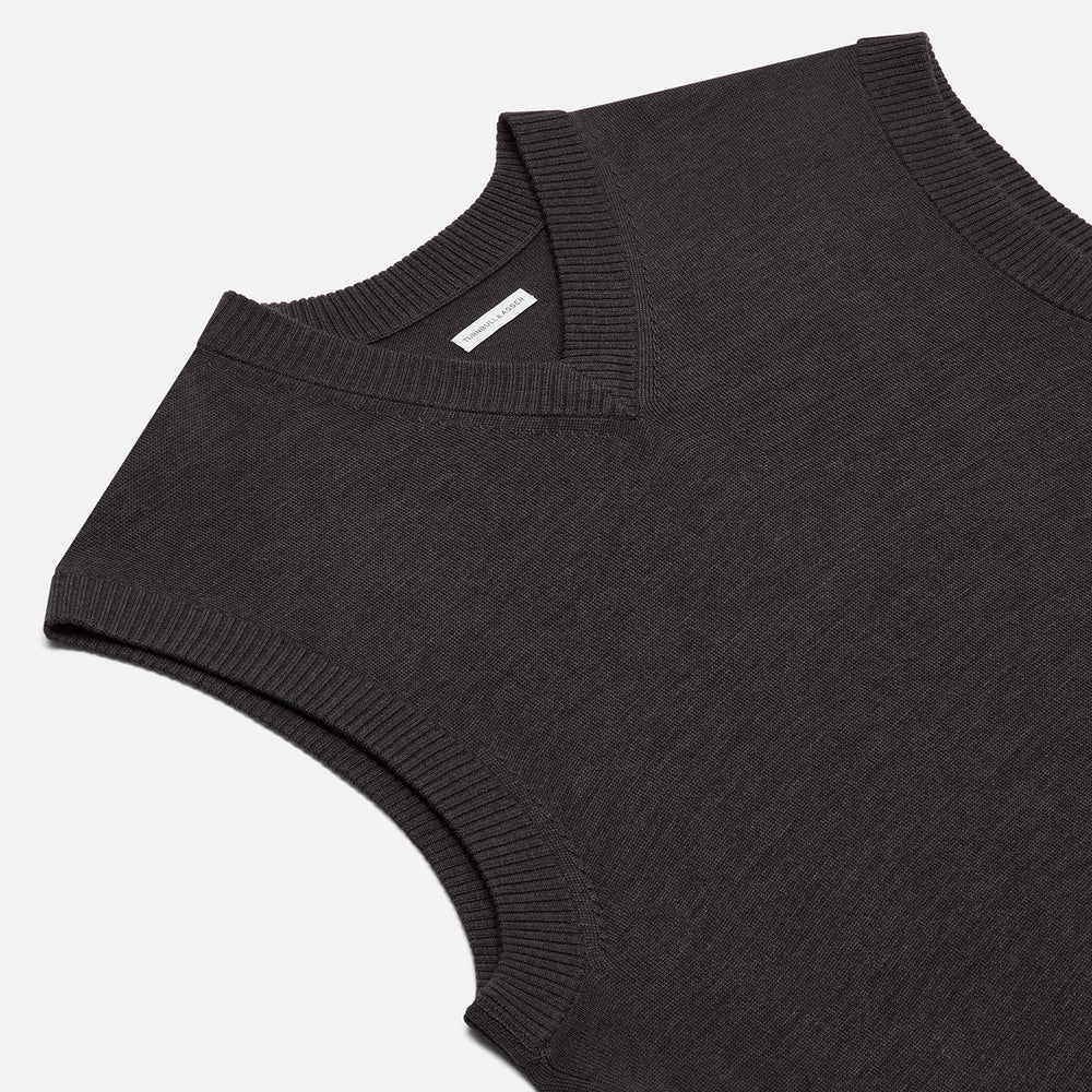 The Turnbull & Asser Brown Fine Merino V-Neck Vest features a sleeveless design with wide shoulders, ideal for layering in cooler seasons, shown here against a plain white background.