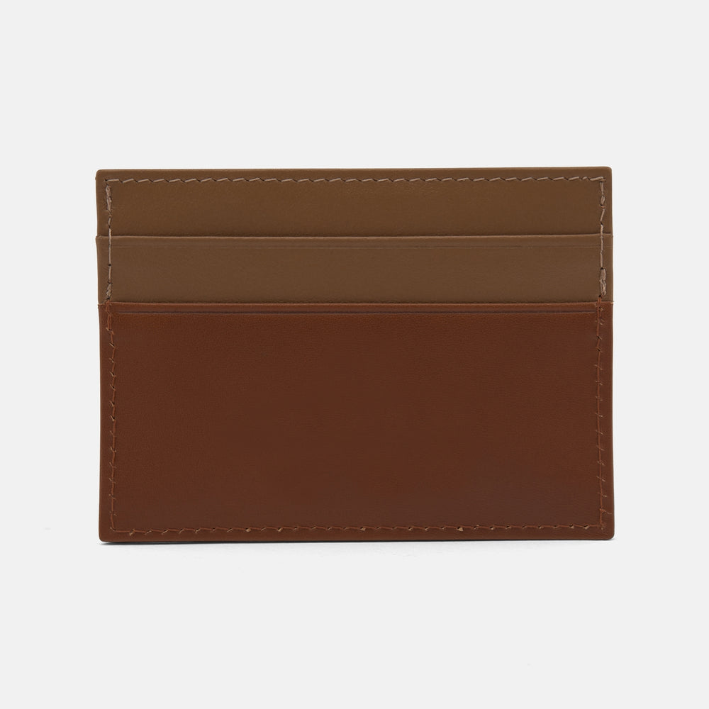 The Brown Leather Card Case by Turnbull & Asser is a minimalist brown and tan accessory crafted from premium bridle hide leather.
