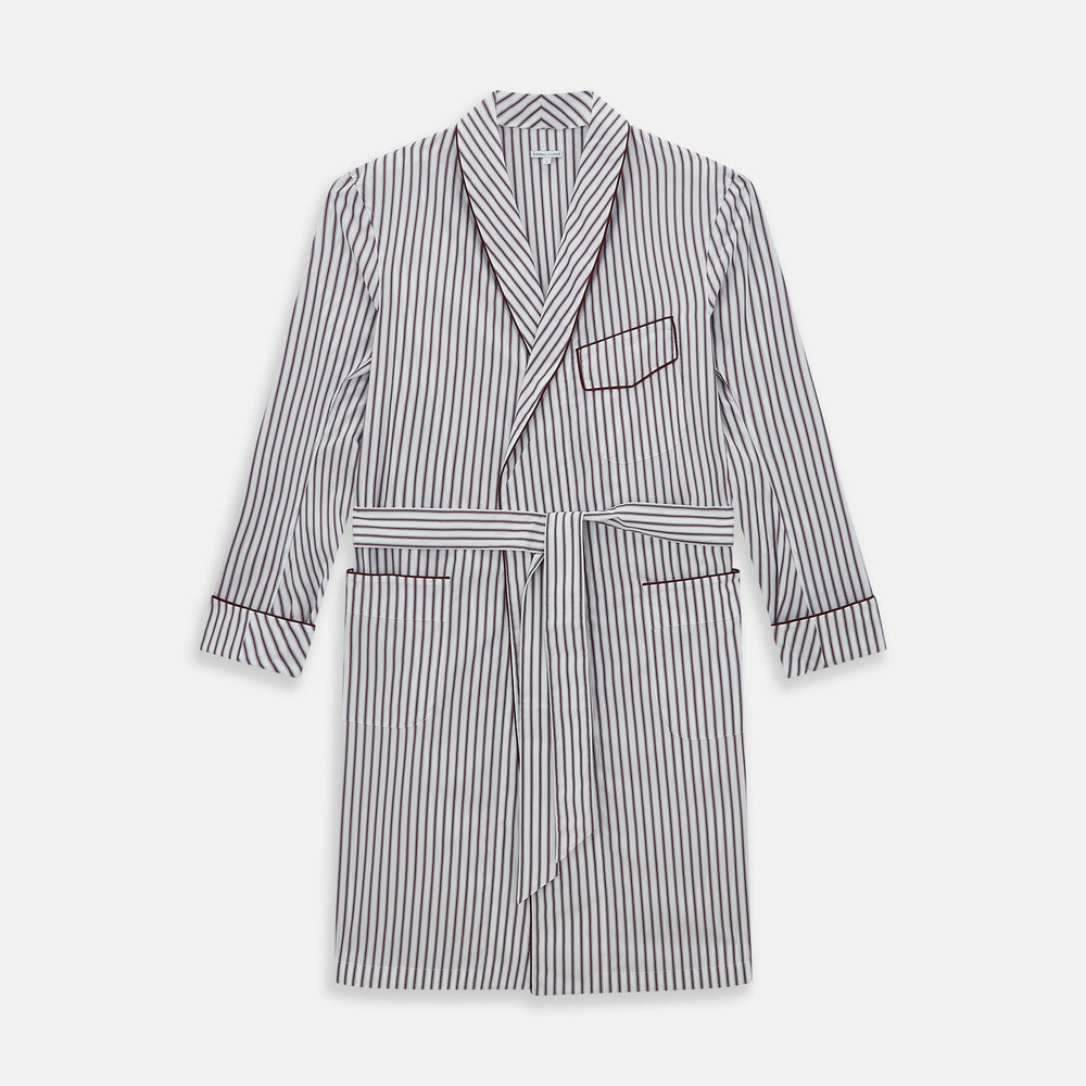 The Burgundy Multi Stripe Winston Gown by Turnbull & Asser features long sleeves, a shawl collar, waist belt, three pockets, and red piping accents for a classic Churchill-inspired touch.