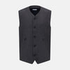 View 1 of product The Turnbull & Asser Ash Linen Twill Waistcoat is a dark gray, sleeveless V-neck with three front buttons, a chest pocket, and two diagonal zippered pockets in subtly textured twill. Shown on a plain white background.